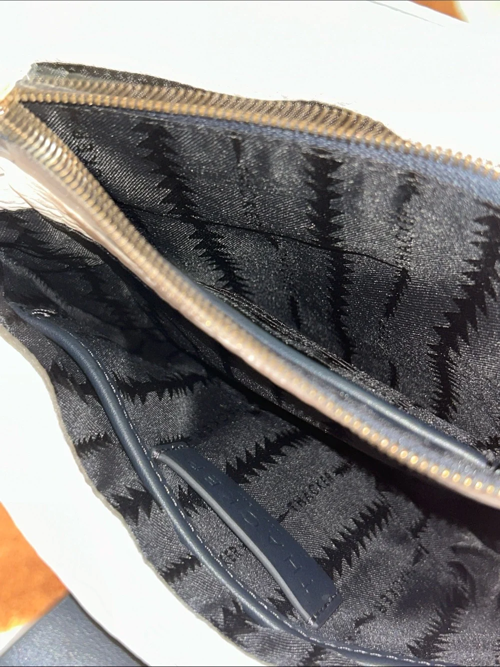 Cream Crossbody Bag with Black Strap and Gold Chain Accent